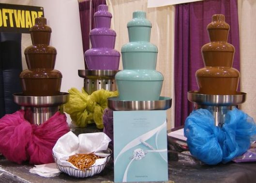 Chocolate fountains showing different colored chocolate that can be ordered